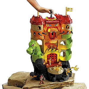 Original tall orange and green Dragon World Fortress with figures, a rocky base and a hand turning the top activation disk