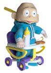 Dil in teal clothing sits in a purple and yellow wheeled seat with a pale tray, yellow bottle and biscuit-shaped accessory.