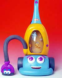 Dusty toy vacuum with a blue smiling base, yellow display housing, tall blue handle and purple smiling brush on a hose.