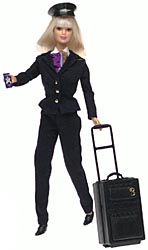 Pilot Barbie in a dark trouser suit and cap, with a patterned scarf and black suitcase on an extended handle.